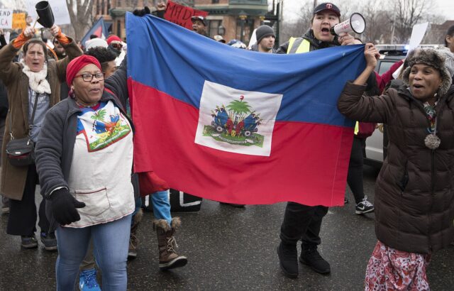 Haitian_immigrants_protesting_Trump_immigration_policies_(25934143138)